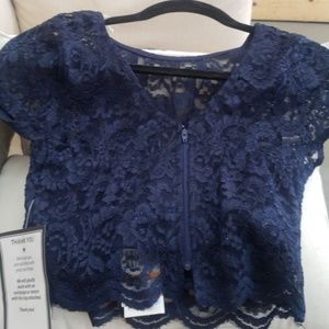 navy blue top with zipper on the back
